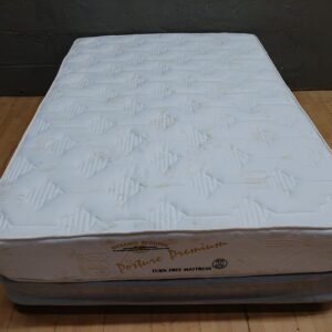 Dynamic Bedding Posture Premium double mattress on grey divan base (used, stained)
