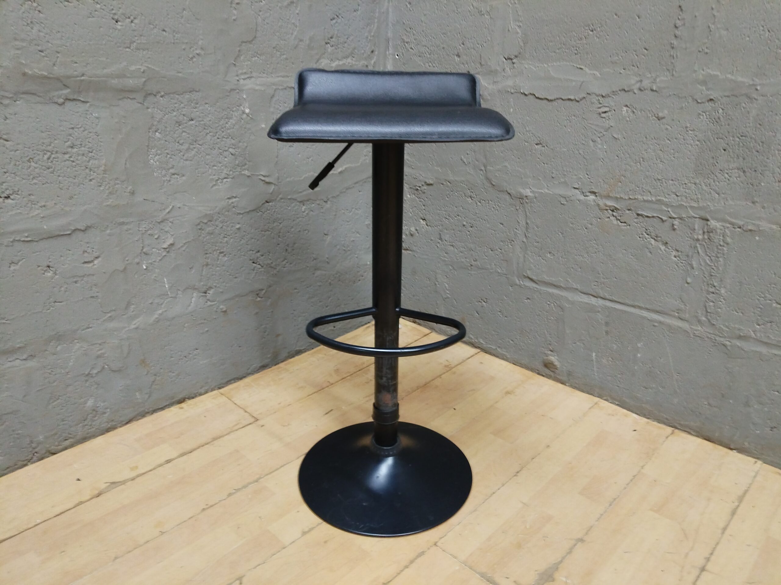 Black Adjustable Bar Stool with Round Pedestal Base — Used, Visible Wear