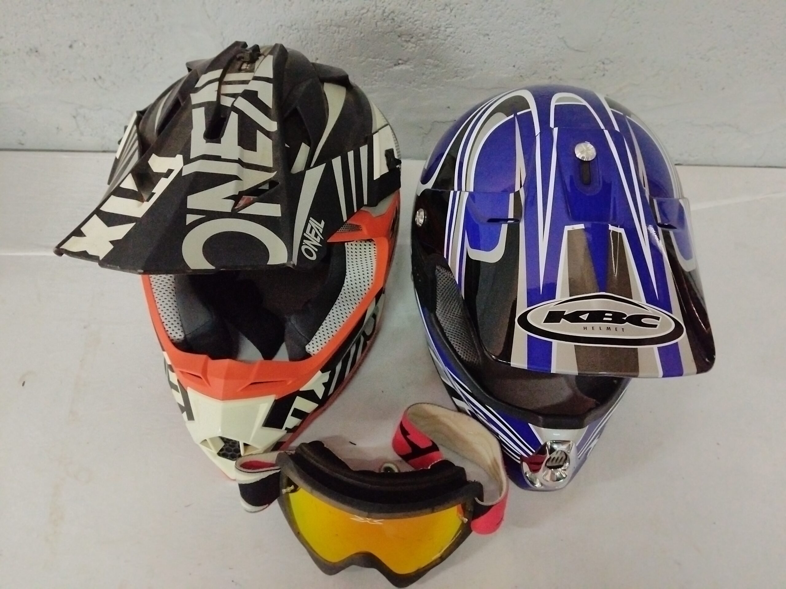 Pair of Dirt/Motocross Helmets (2) with Goggles — O’NEAL & KBC, used