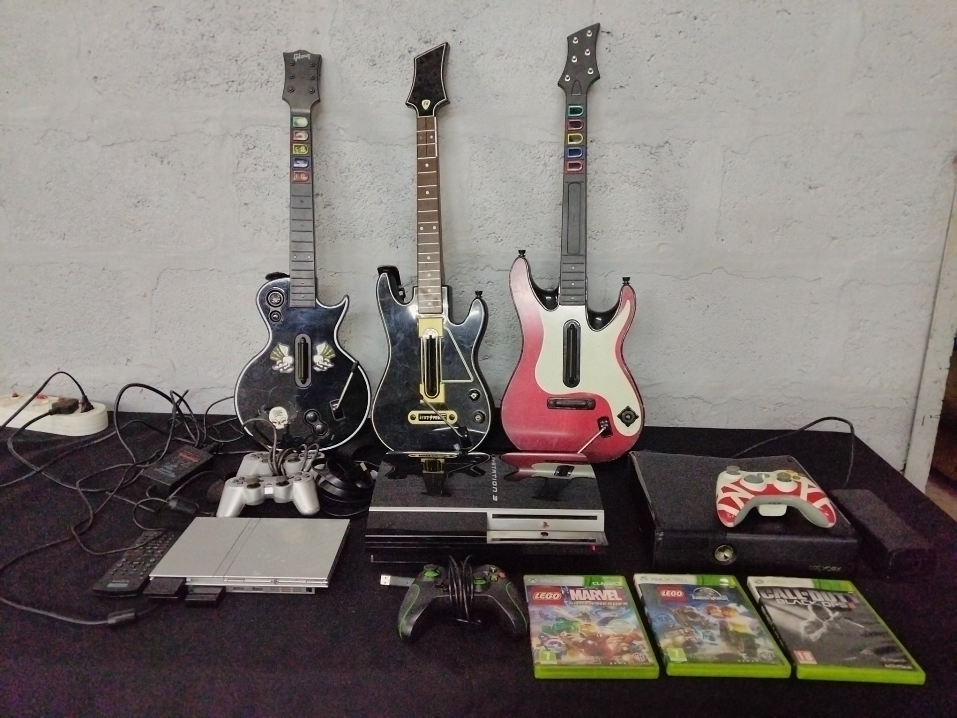 Bulk Lot: PlayStation 2 Slim, PlayStation 3, Xbox 360 S, Guitar Controllers, Games & Accessories (Working with Faults, Some Cables Missing)