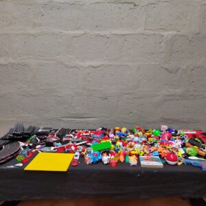 Mixed bulk lot of ~200 used small toys, figures, cars + partial Carrera slot-car track & control module (not working)