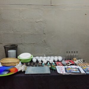 Bulk mixed household lot — cups, glass bottles, knives (57 items, used/mixed condition)