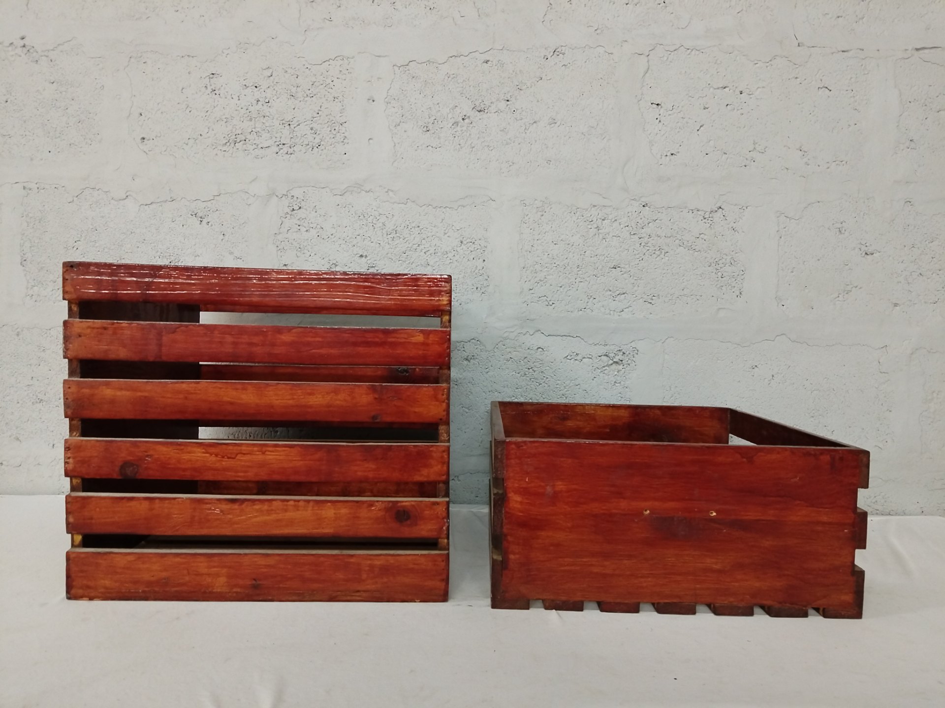 Pair of varnished slatted wooden storage crates — 2 pieces