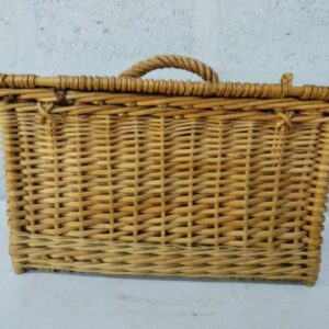 Woven wicker storage/picnic basket with hinged lid, twisted handle and small feet — fair condition