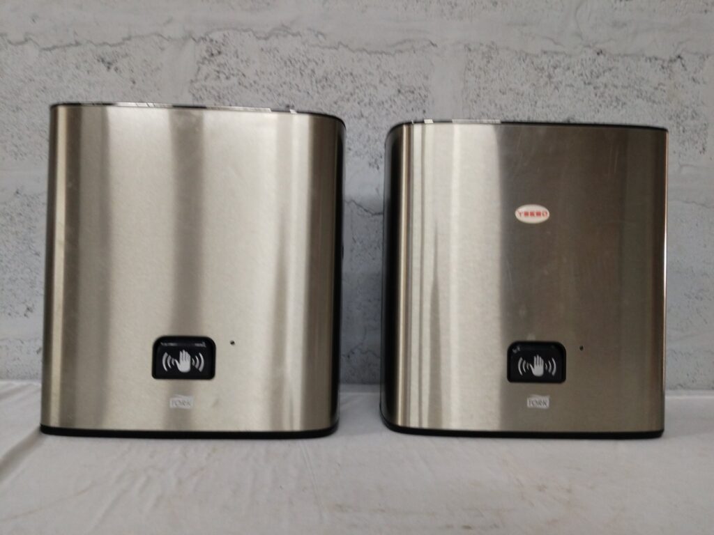Lot of 2 Tork stainless automatic paper towel dispensers — battery-powered, working with faults (broken towel holder)