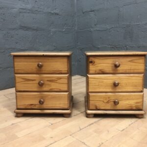 Pair of small three-drawer bedside cabinets, light brown honey tone