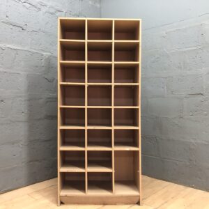 Multi-compartment cubby shelving unit — light wood-tone finish, freestanding