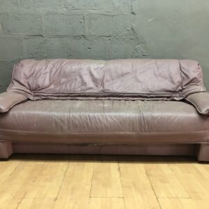 Three-seat brown/plum sofa — heavy surface wear, used