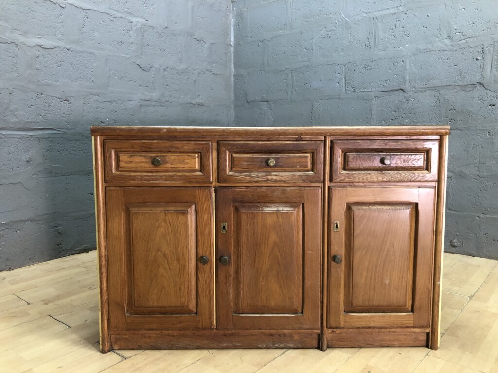 Wood-tone Sideboard / Cabinet — 3 Drawers, 3 Doors, Noticeable Top Stain