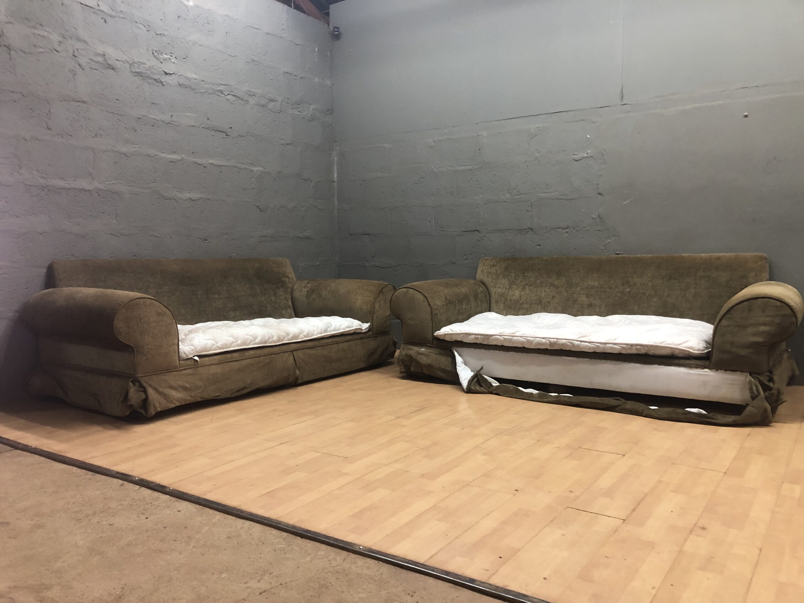 Pair of Upholstered Sofas (Matching) — Right Sofa Skirt Detached, Seats Sagging