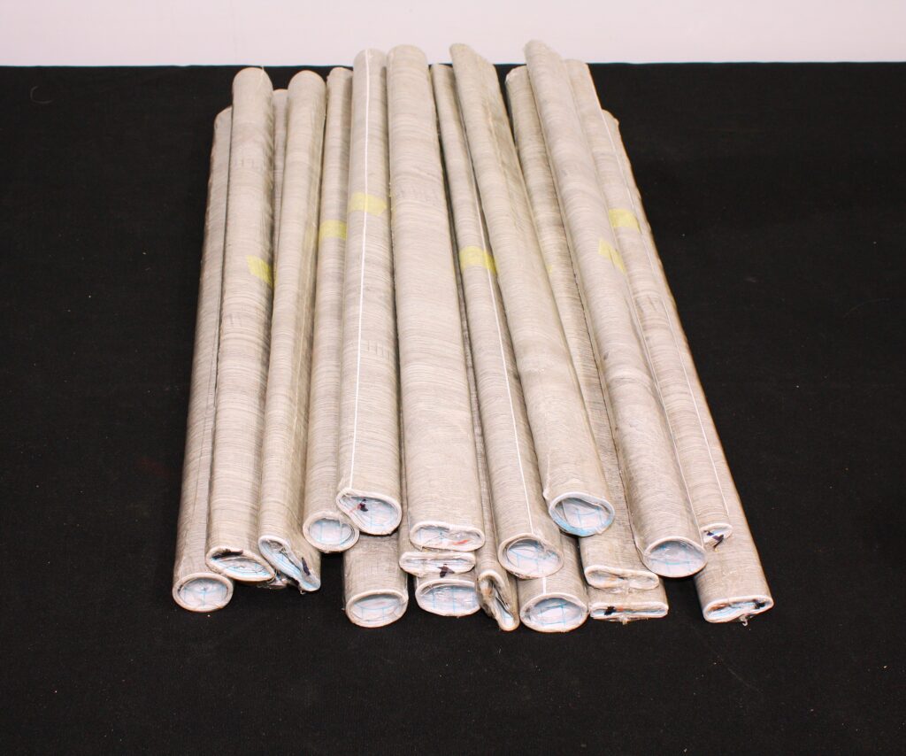 Bundle of Contact Adhesive Vinyl Wrap Rolls (approx. 15 visible)