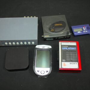 Mixed electronic lot — Walkman, Discman, PDA, Apple TV-style box, KORG tuner, video unit (6pcs)