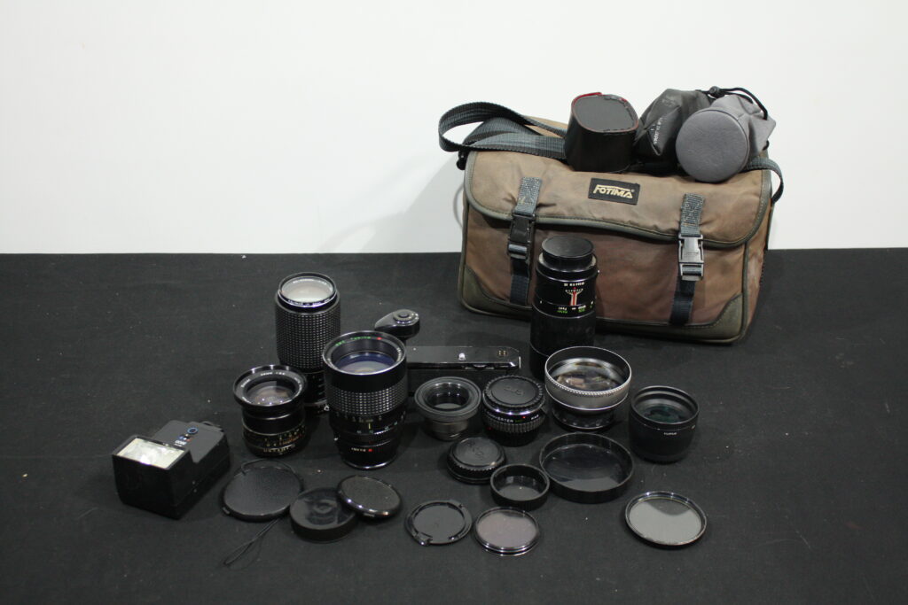 Mixed Lot of Approximately 8 Used Camera Lenses with Bag, Caps, Filters & Flash
