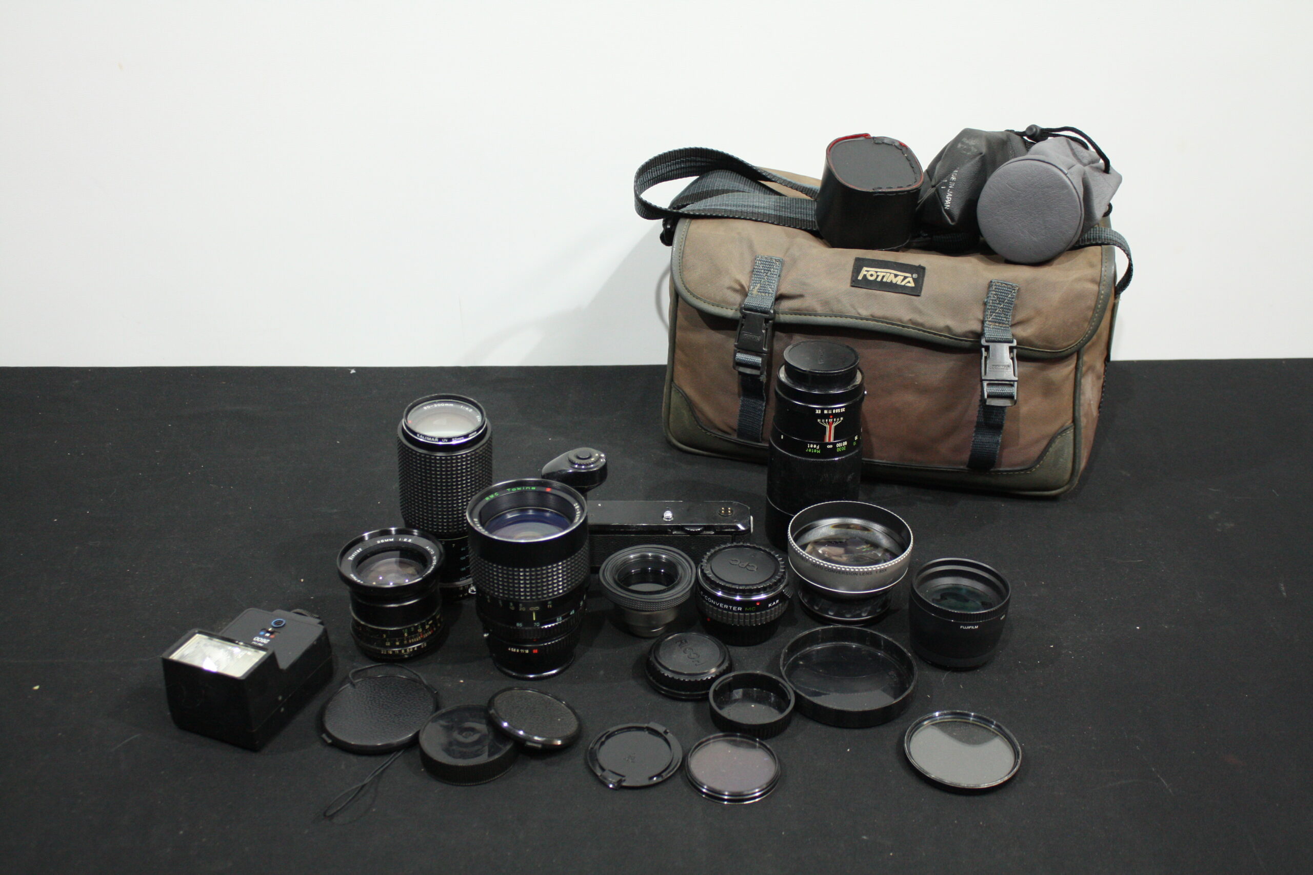 Mixed Lot of Approximately 8 Used Camera Lenses with Bag, Caps, Filters & Flash