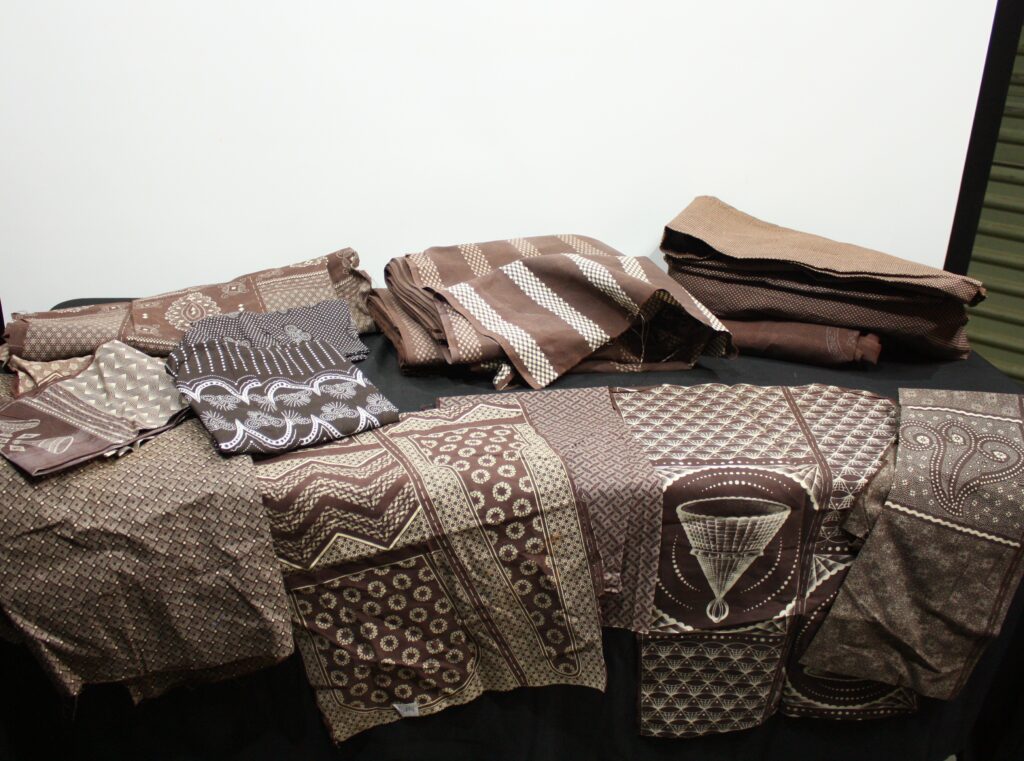 Lot of Brown Patterned Fabrics (Various Prints) — At least 8 pieces visible