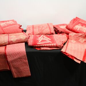 Lot of red printed African-style fabric — approx. 8 folded pieces