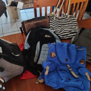 Mixed lot of 6 used bags — backpacks, tote and satchel, grey & black