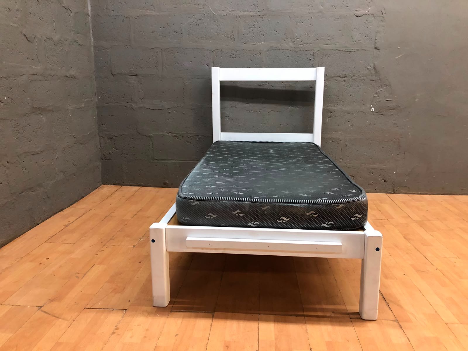 Single white painted wooden bed frame with single mattress — used, cosmetic wear