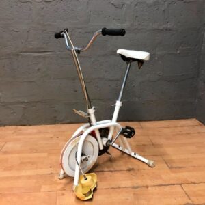 Pro Bike System 1000 stationary exercise bike — mechanical console, cosmetic wear & cracked housing