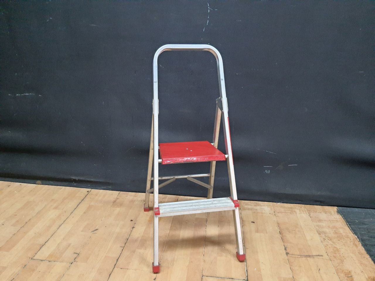Folding 2-Step Metal Step Ladder with Red Plastic Steps