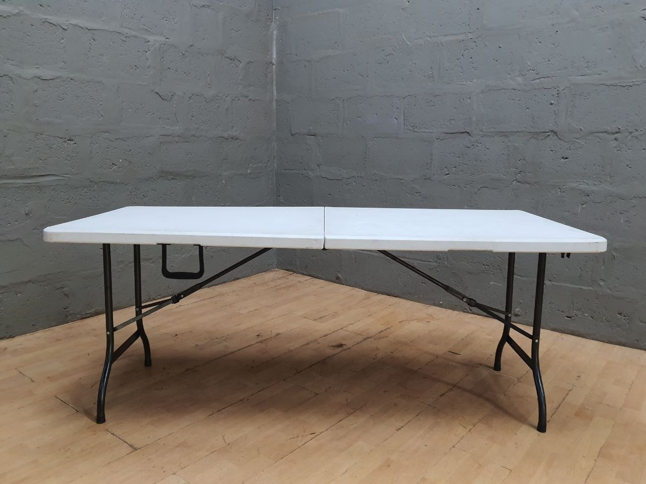 Folding Plastic Trestle Table – Used, Sturdy, Practical