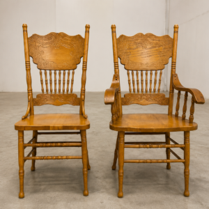 Pair of Colonial Dining Chairs — one armchair + one side chair, light brown finish
