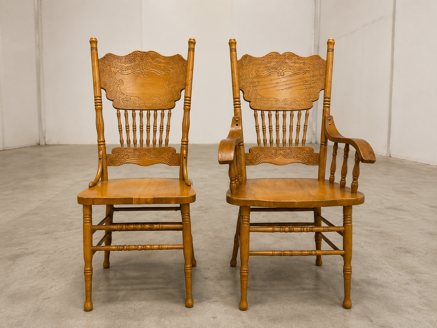 Pair of Colonial Dining Chairs — one armchair + one side chair, light brown finish