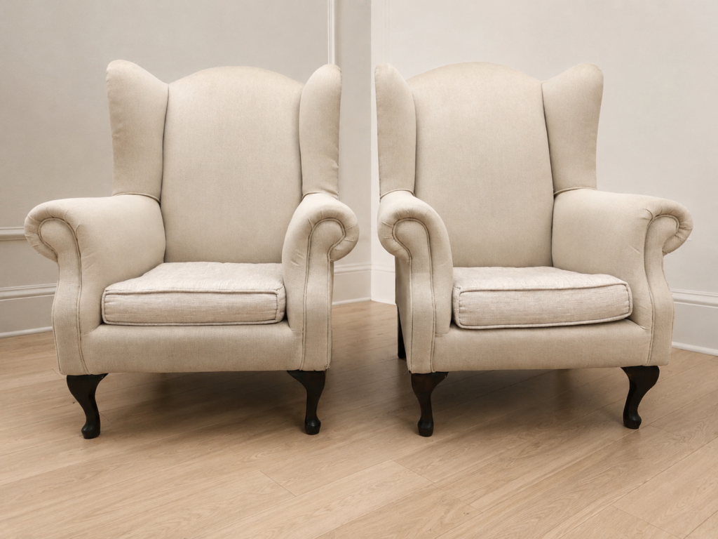 Pair of Beige Upholstered Wingback Armchairs with Removable Seat Cushions