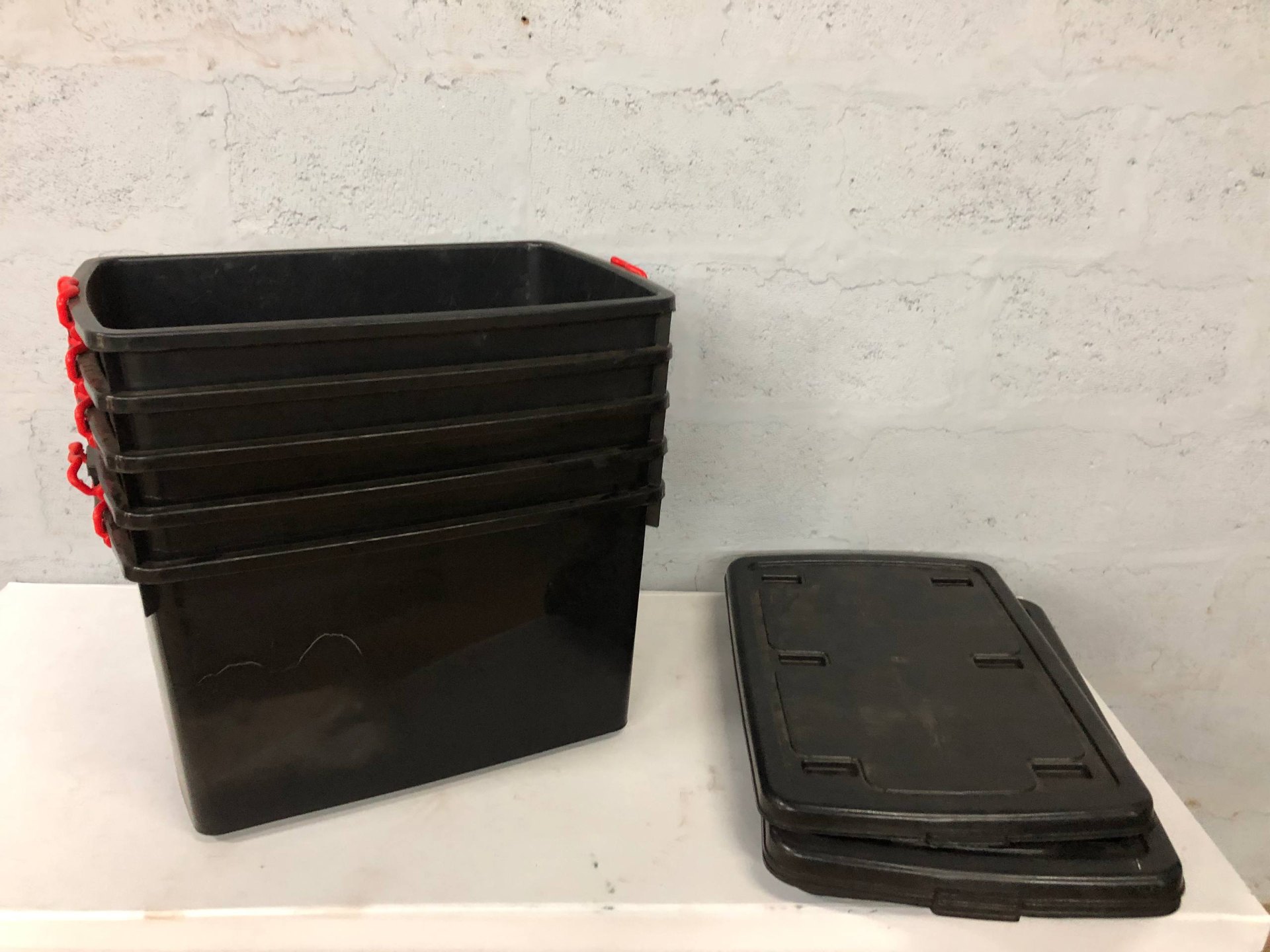 Bulk Lot: 4 Black Plastic Storage Tubs with Red Handles & Lids – Good Used Condition