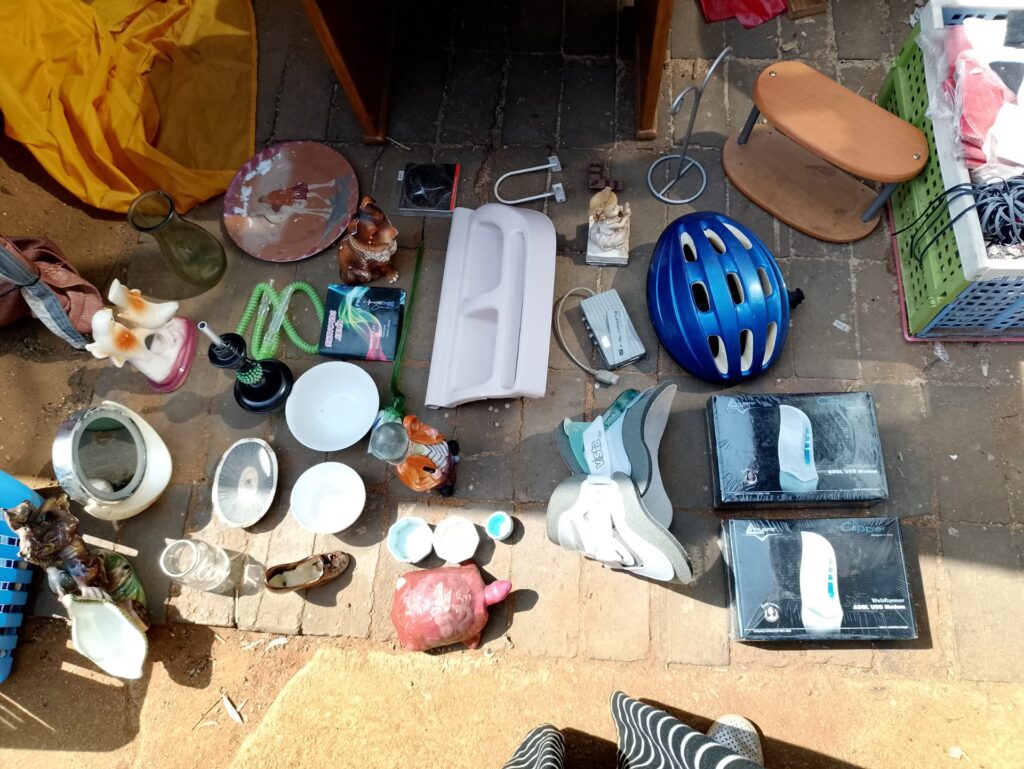 Mixed household lot — boxed Atlantis ADSL modems, blue bicycle helmet, wooden two-step stool, assorted ceramics & homewares (approx. 32 pieces) — used, untested electronics