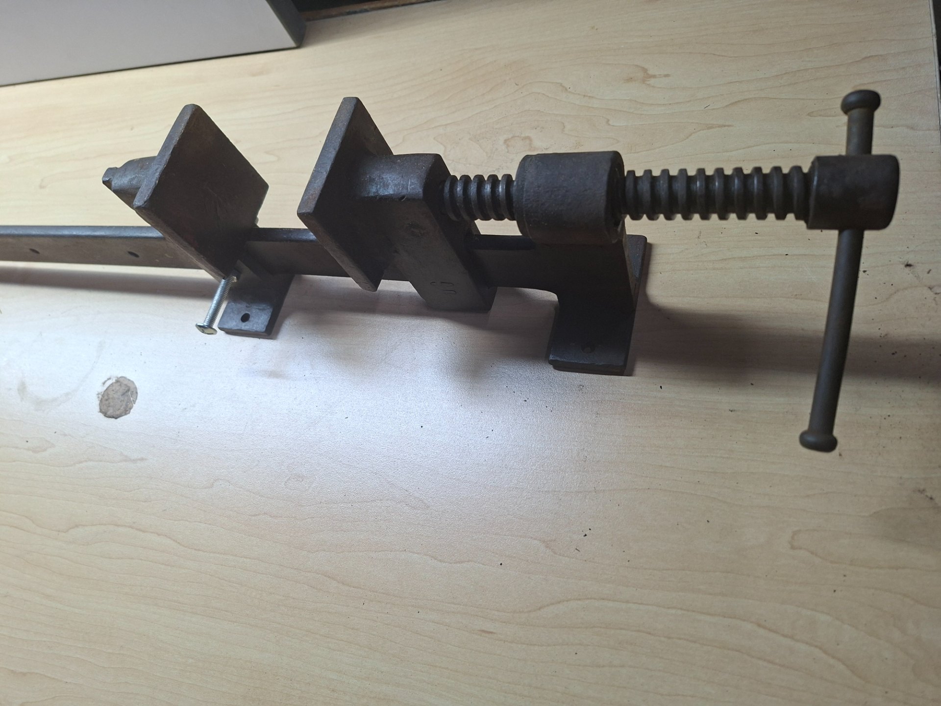 Cast-iron bar / sash clamp with lead screw — long bar, sliding jaw (heavy surface rust, appears complete, operates smoothly)