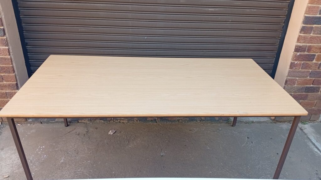 Large rectangular laminate/veneer table with metal legs — 180 x 90 x 75 cm (used, edge delamination)