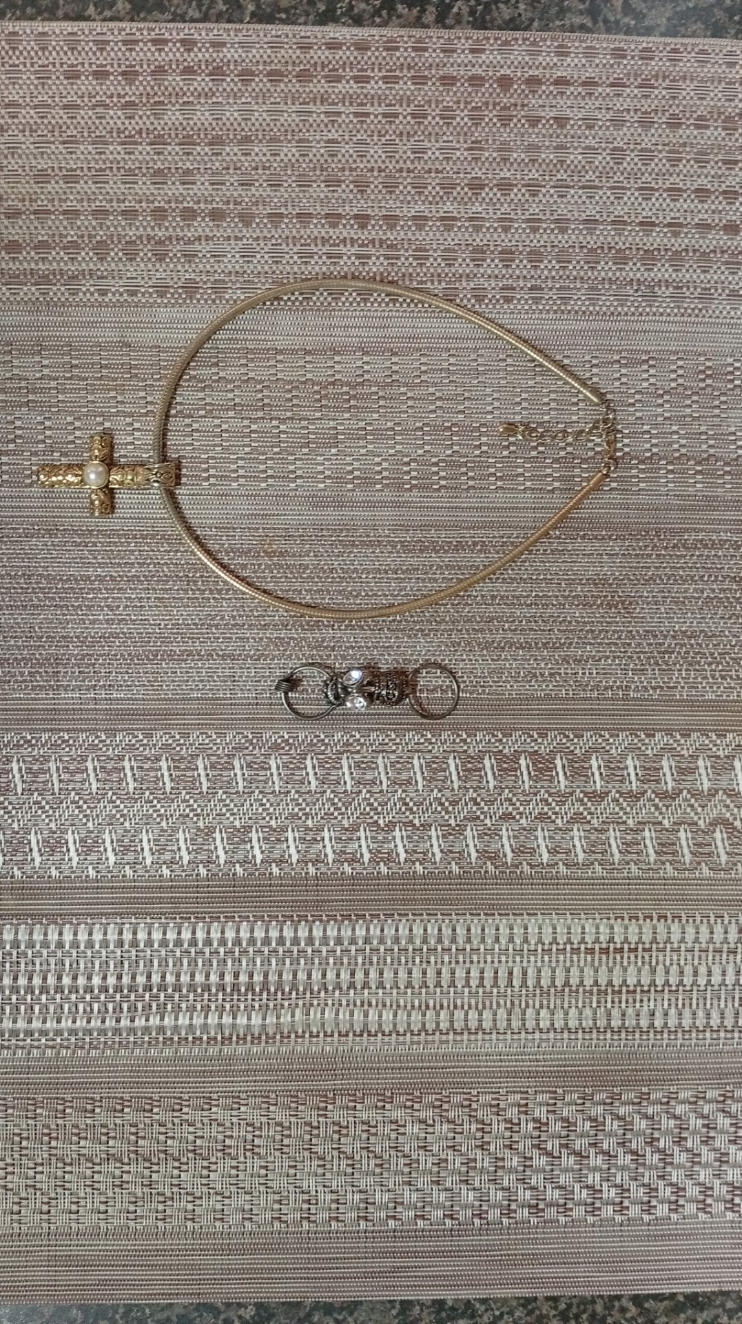 Mixed jewellery lot – gold-tone snake chain necklace with ornate cross pendant (central pearl‑style cabochon) + silver-tone charm/keyring