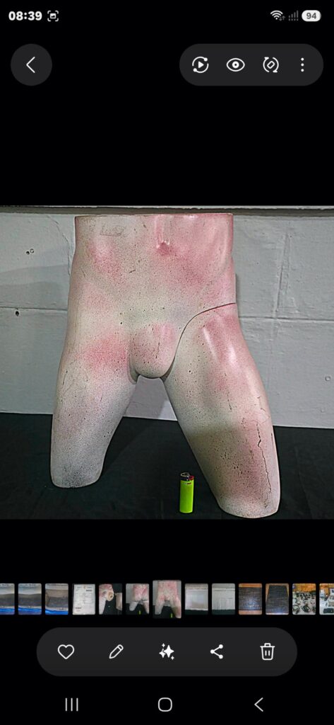 Lower-torso male display mannequin — one detached leg included, visible cracks & spray paint