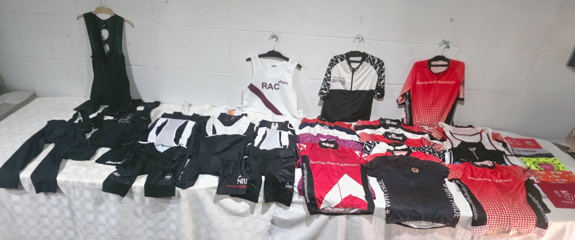Mixed bulk lot of cycling kit — jerseys, bib-shorts and vests (used, various)