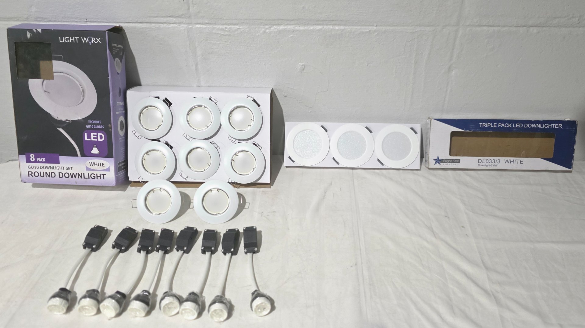 Mixed lighting lot — Light Worx GU10 8-pack downlight trims + Bright Star triple LED panels, bulbs & drivers (boxes opened)