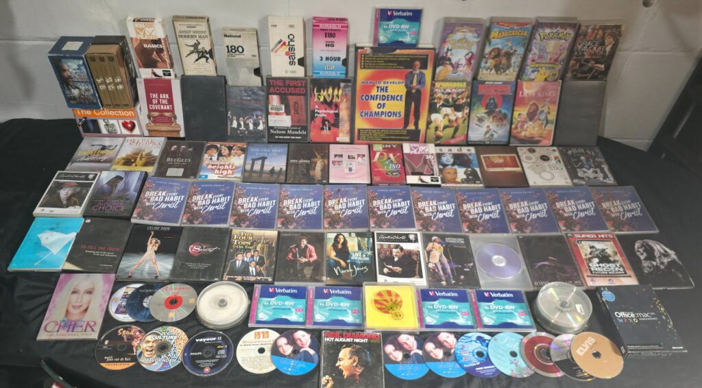 Lot of 93 Assorted Media — VHS tapes, Commercial DVDs, Audio CDs, Verbatim 6x DVD‑RW packs & spindles