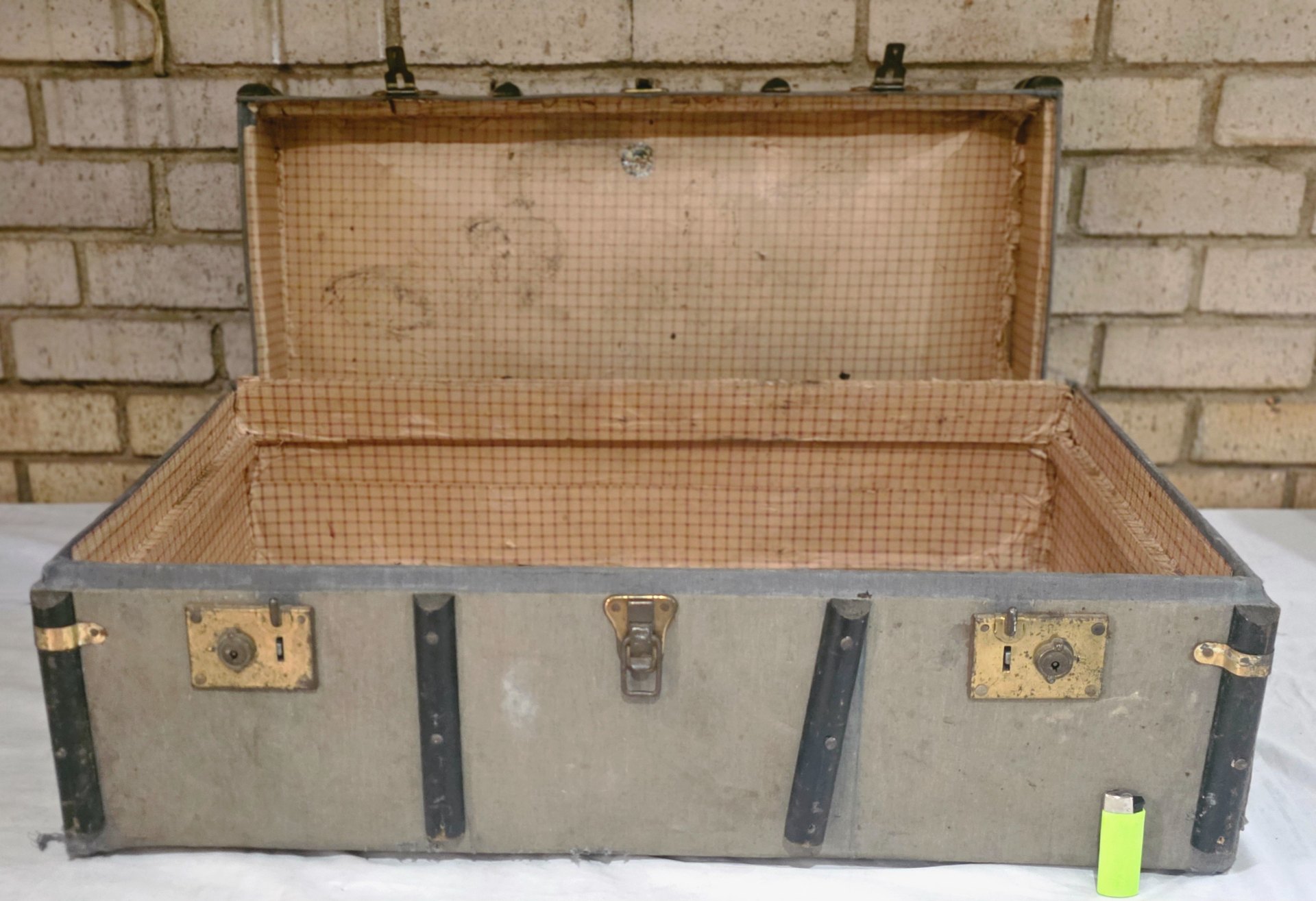 Canvas-covered travel trunk — worn interior, torn lining, locks do not work
