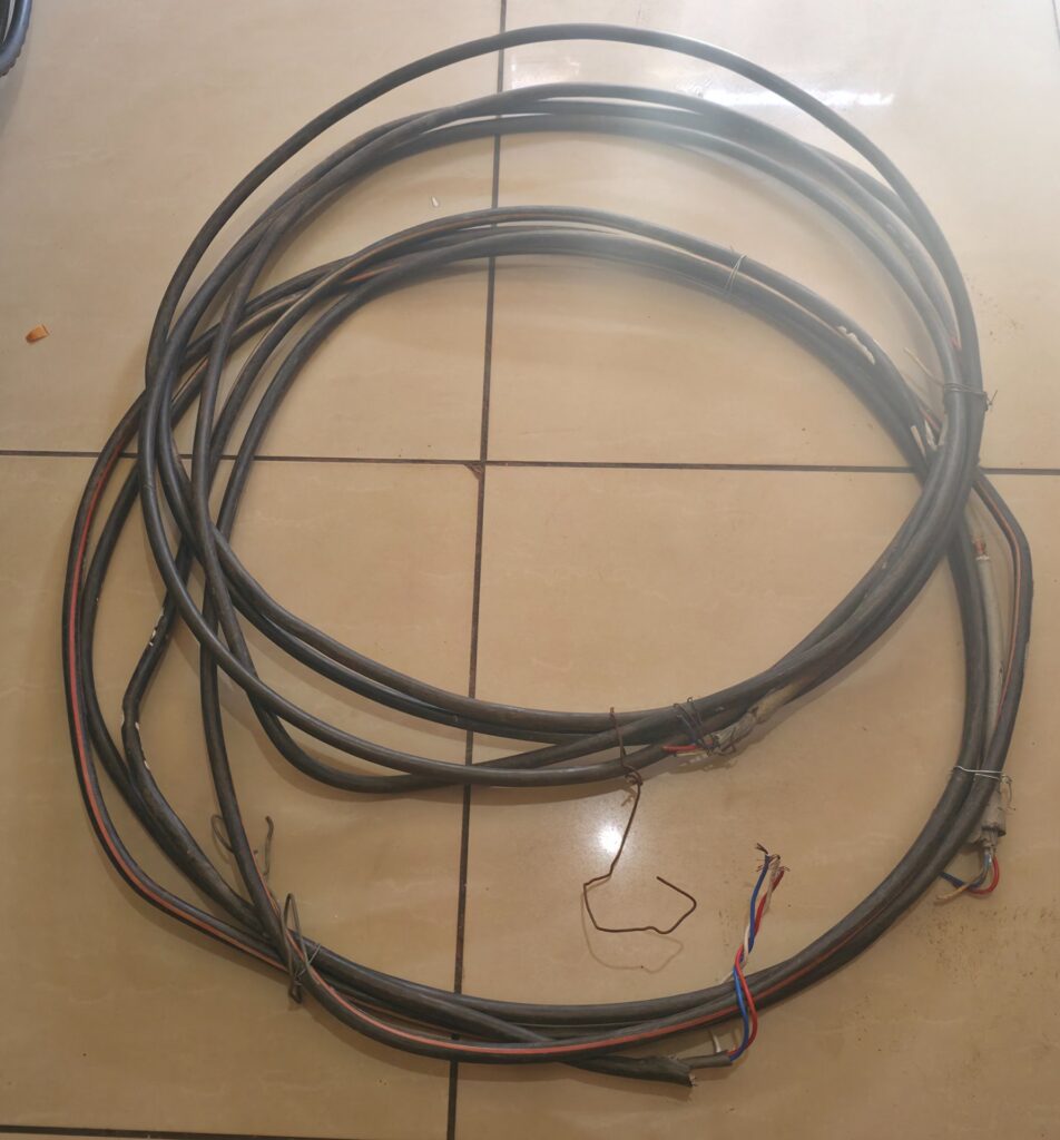 Lot: 2 x coiled power/mains cables with exposed ends (used) – mixed lengths, copper conductors