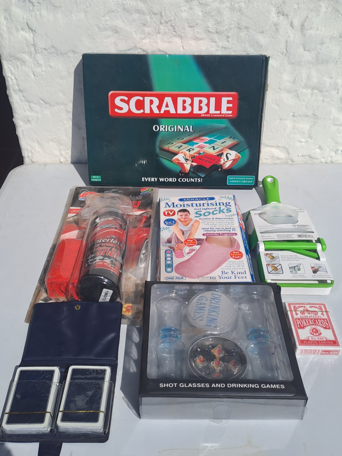 Mixed household & games lot — complete Scrabble, Prepworks julienne & slicer, moisturising socks, waterless car wash, shot-glass drinking game, 3 card decks & pouch