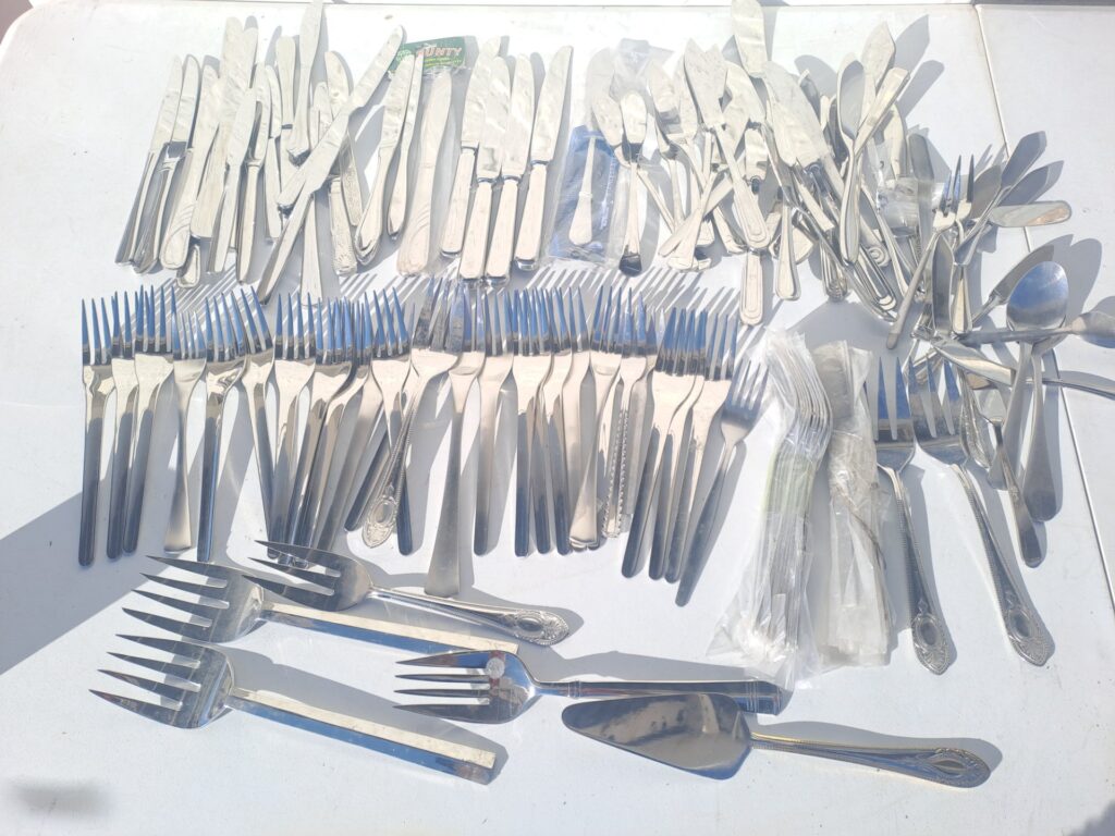 Mixed Stainless Steel Cutlery Lot — Assorted Forks, Knives, Spoons & Serving Pieces (Mixed Patterns, mostly unused)