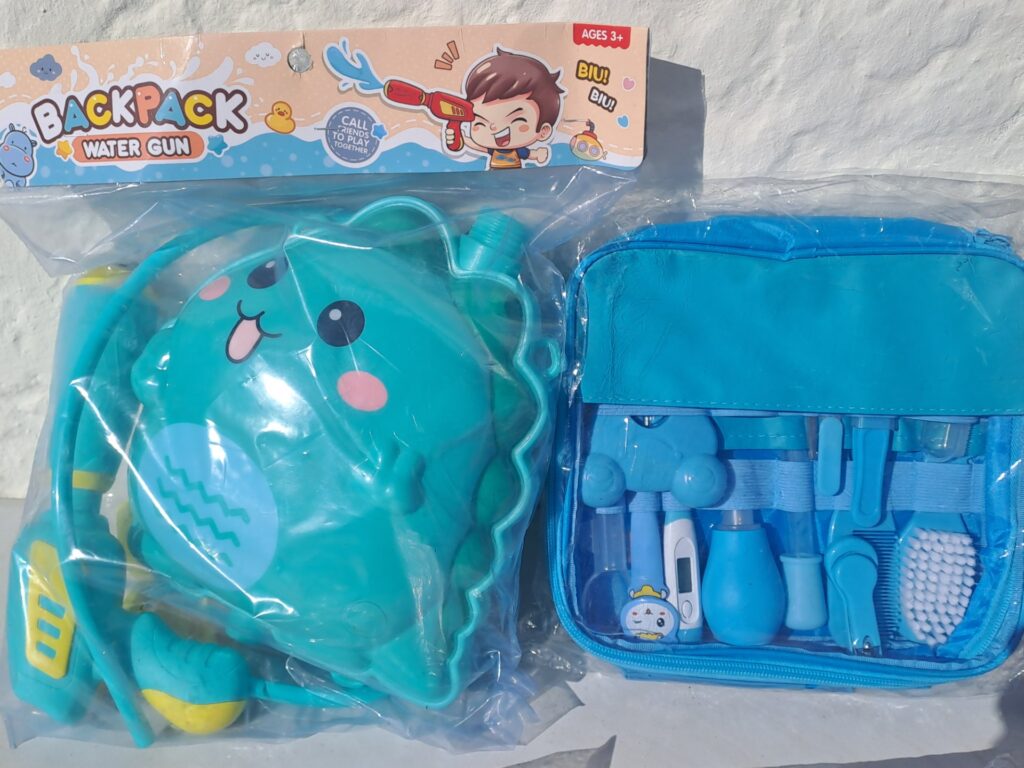 Mixed children’s toy lot – Backpack Water Gun, Baby Manicure Set (blue), Unicorn Inflatable 70cm, Pink Toy Storage Bag — New & Sealed