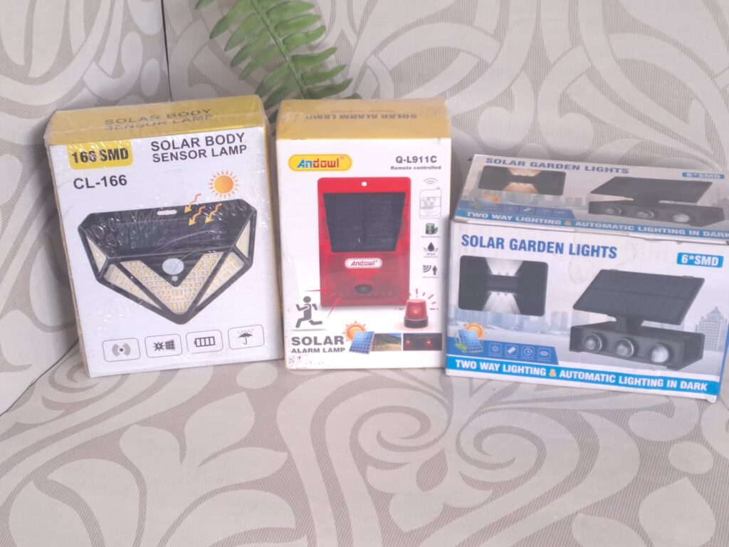 Mixed lot: 3 boxed solar lights — CL-166 Solar Body Sensor, Andowl Q‑L911C Solar Alarm, Solar Garden 6*SMD (sealed boxes, untested)