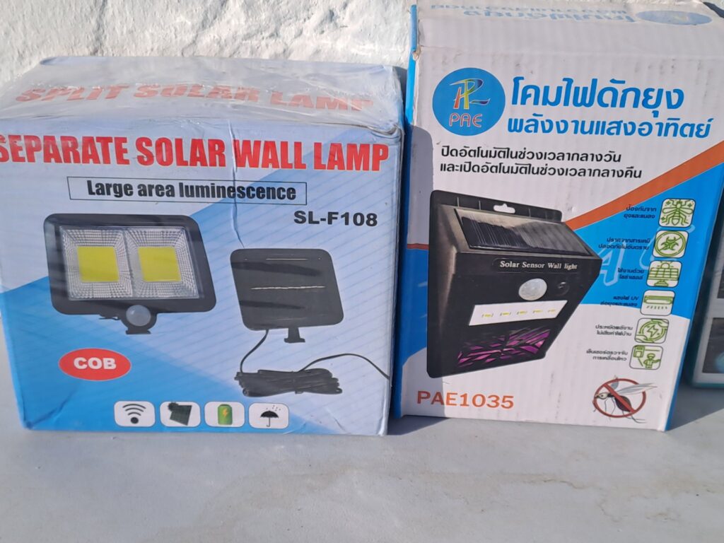 Mixed lot: 4 boxed solar / LED lights — SL-F108 separate solar wall lamp, PAE1035 solar sensor wall light, Solar LED UV bug zapper, aerbes AB-Q629 car ambient LED strip (boxes worn)