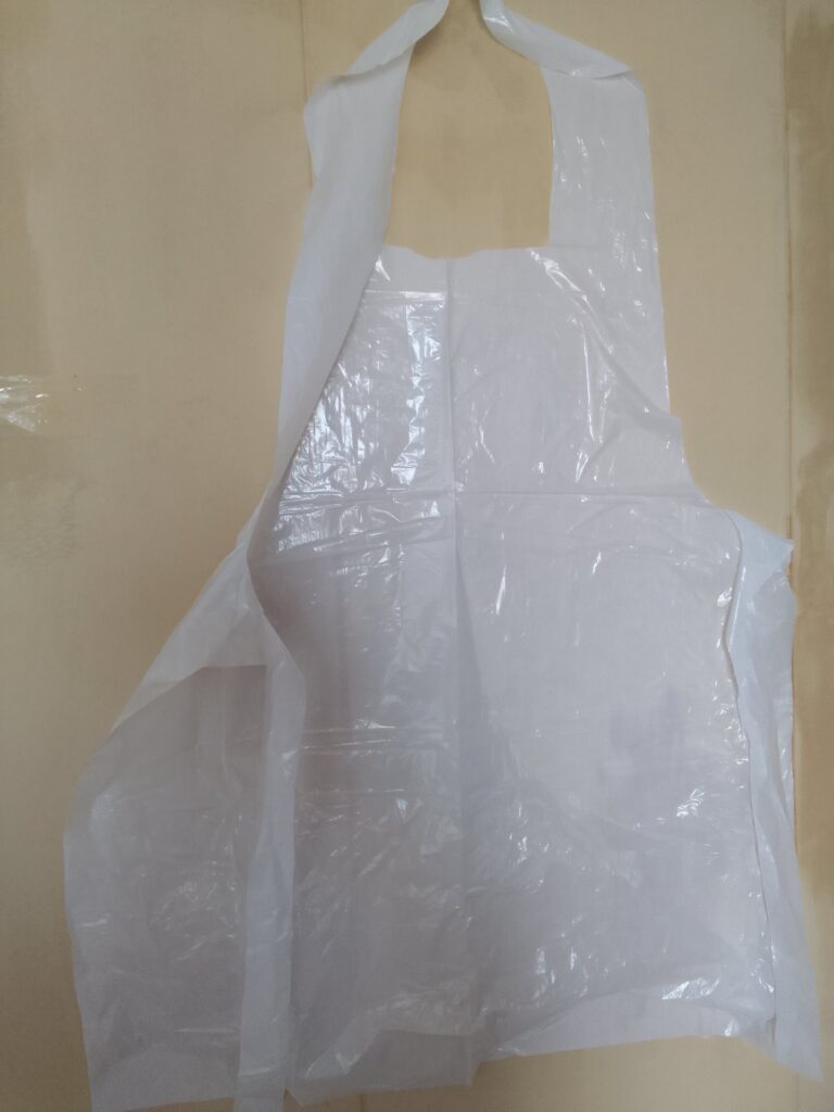 Lot of 200 Brand New Disposable Plastic Aprons — White, Sealed Packs