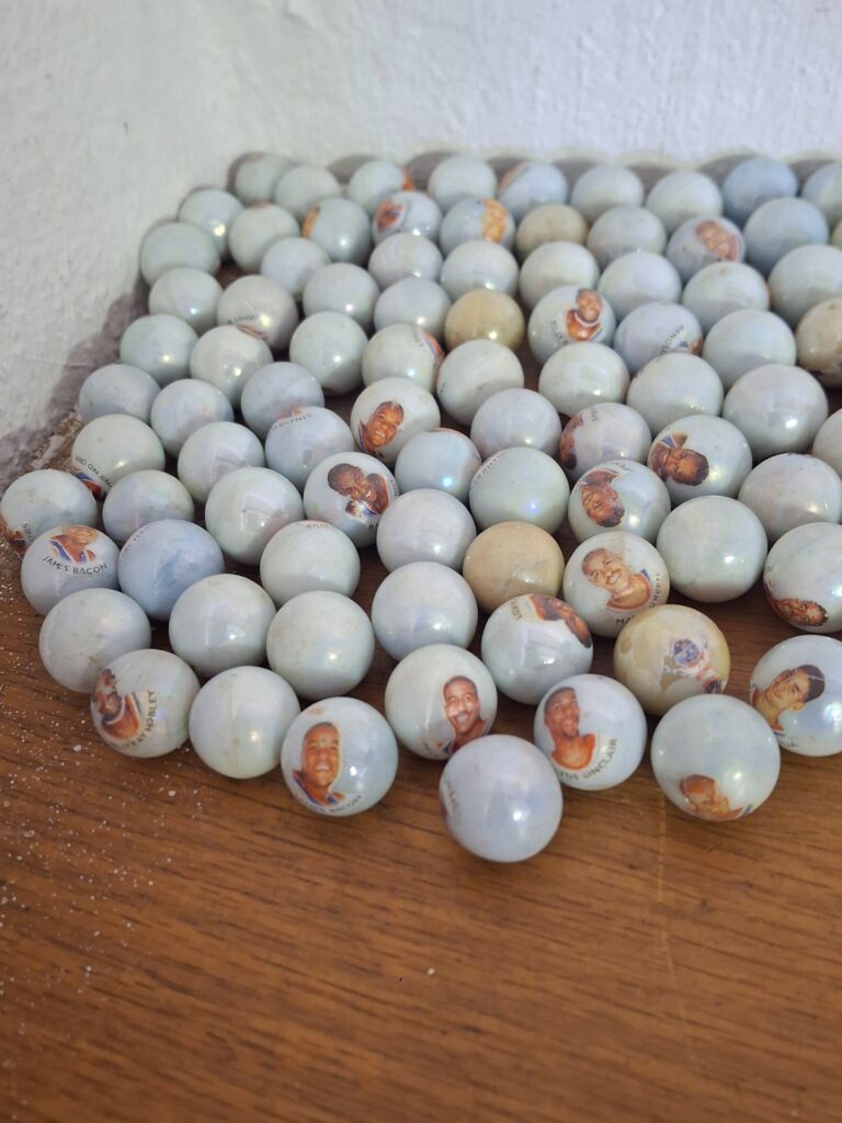 Lot c.100 Porcelain Portrait-Decal Marbles — Bulk vintage-style decorative marbles, worn finish