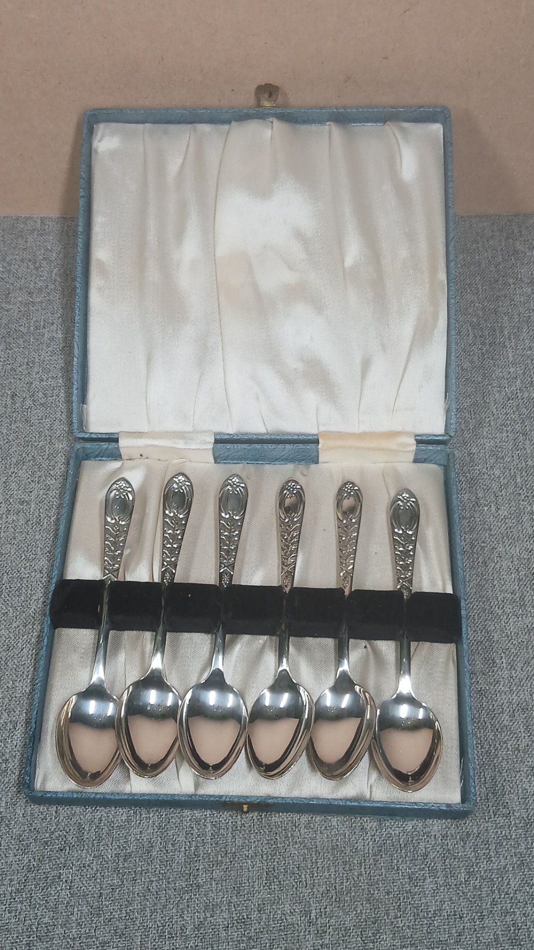 Set of 6 ornate silver‑plated teaspoons in fitted presentation box