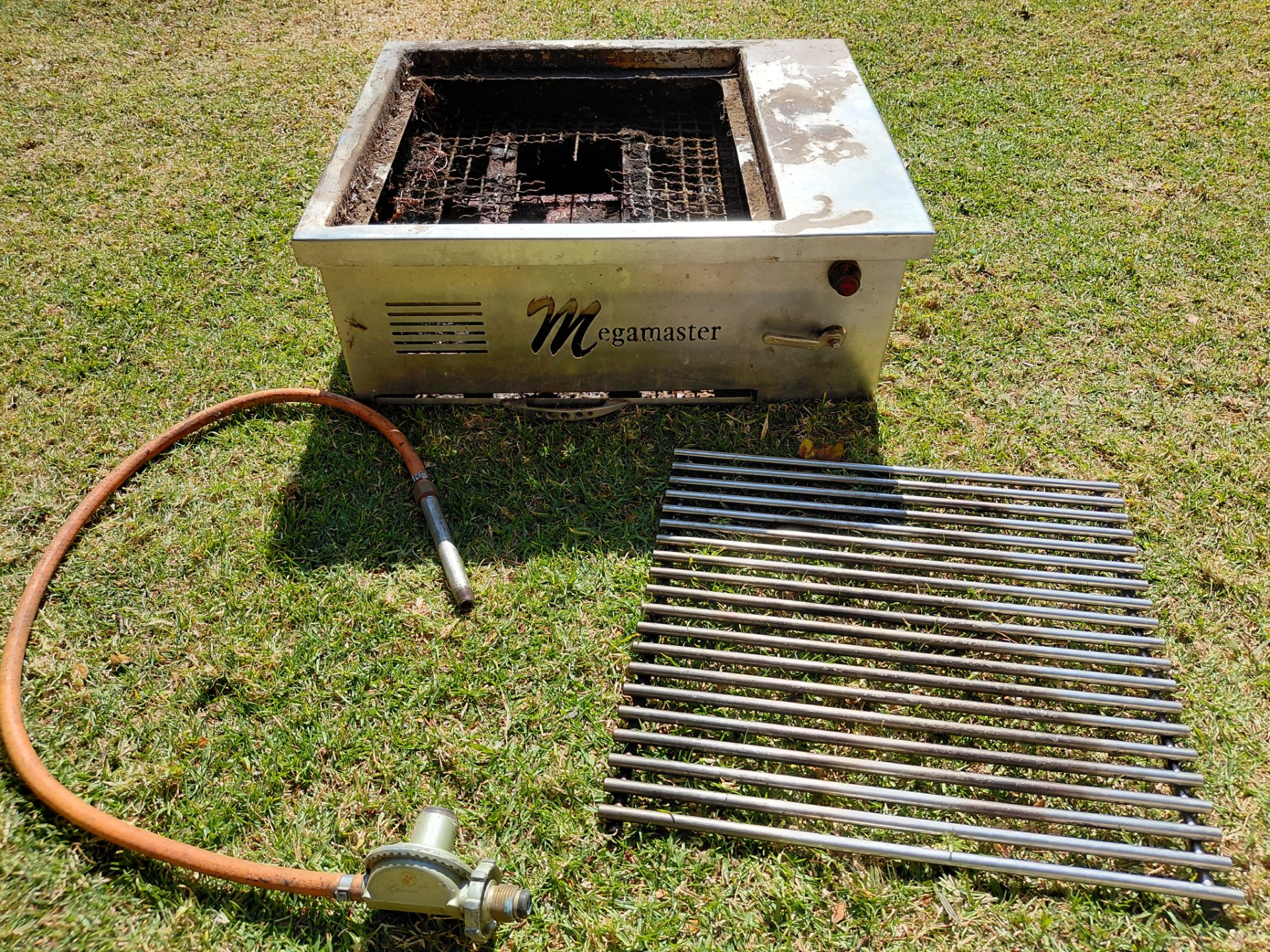 Megamaster built-in LPG gas grill / braai — stainless top, hose & regulator included (needs internal repair)