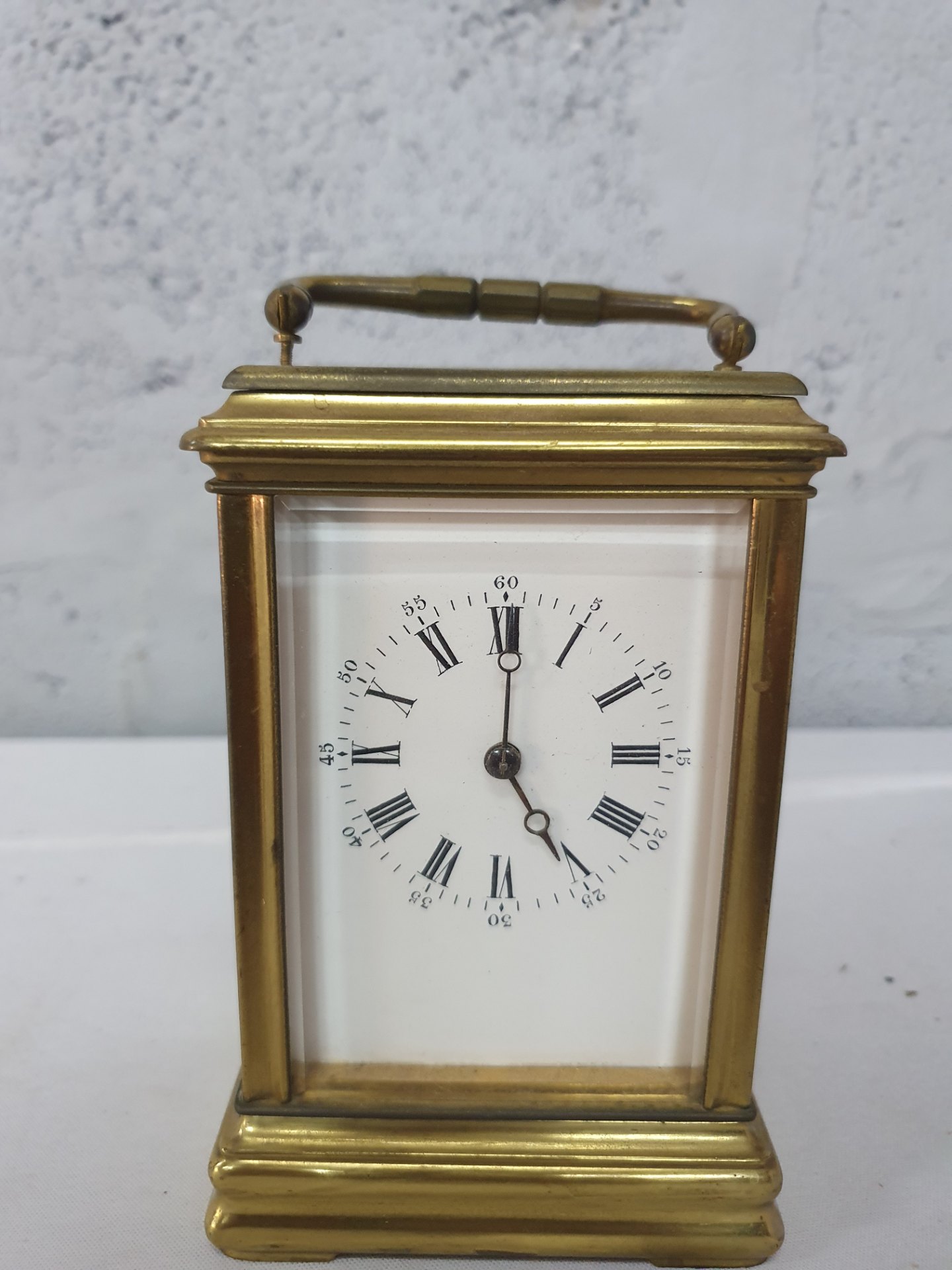 Brass carriage / mantel clock with glass panels — visible movement (for spares / repair)