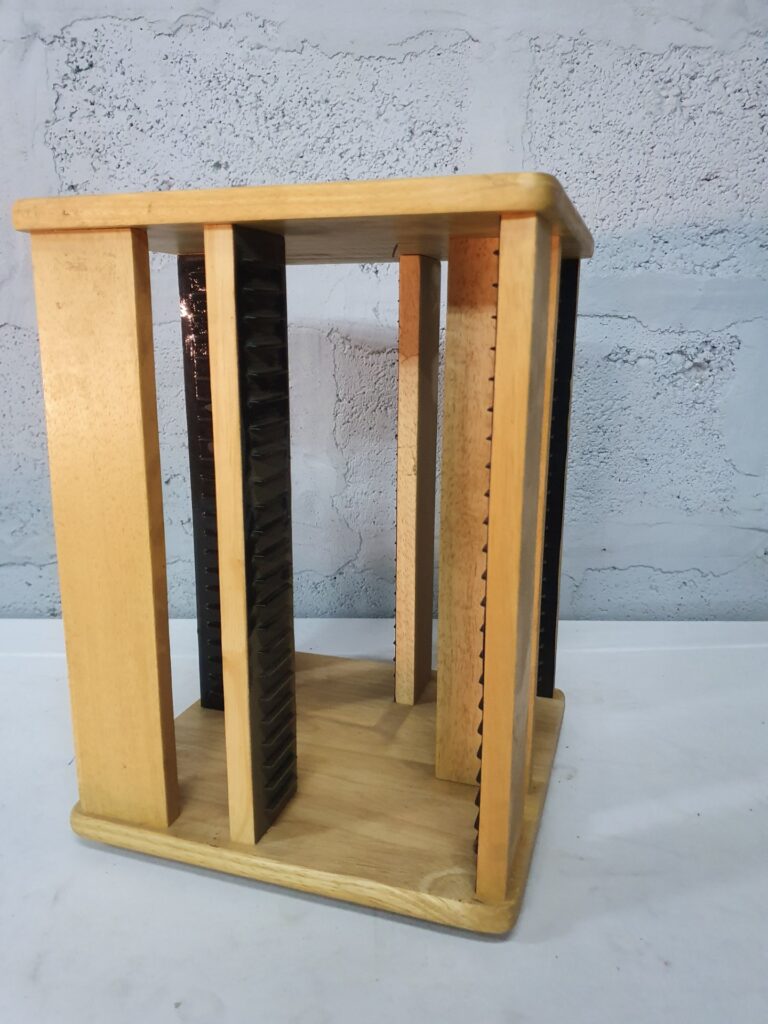 Wooden rotating CD rack with black plastic slot rails — 60‑slot capacity, 37x28x27cm